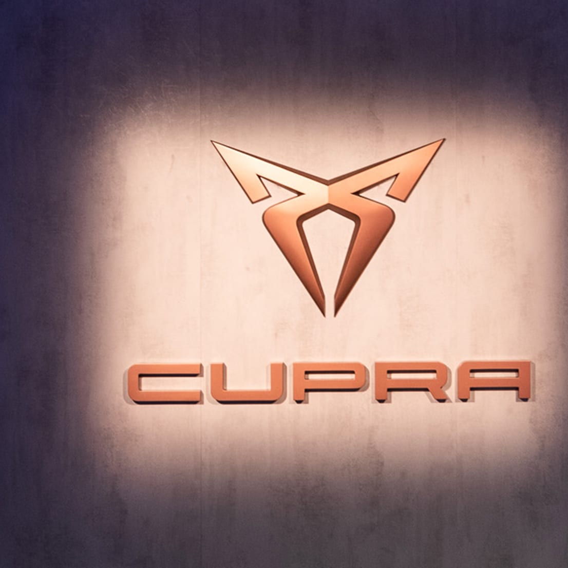 CUPRA logo on a wall