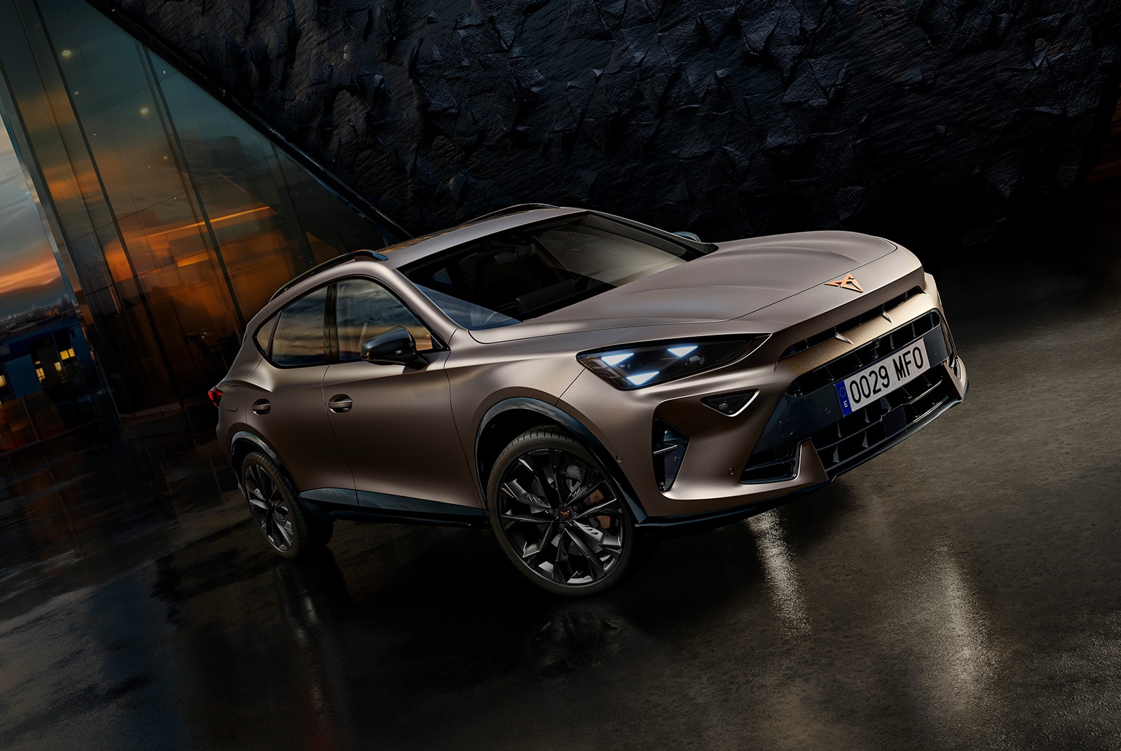 woman standing next to the new cupra formentor suv with full led lights