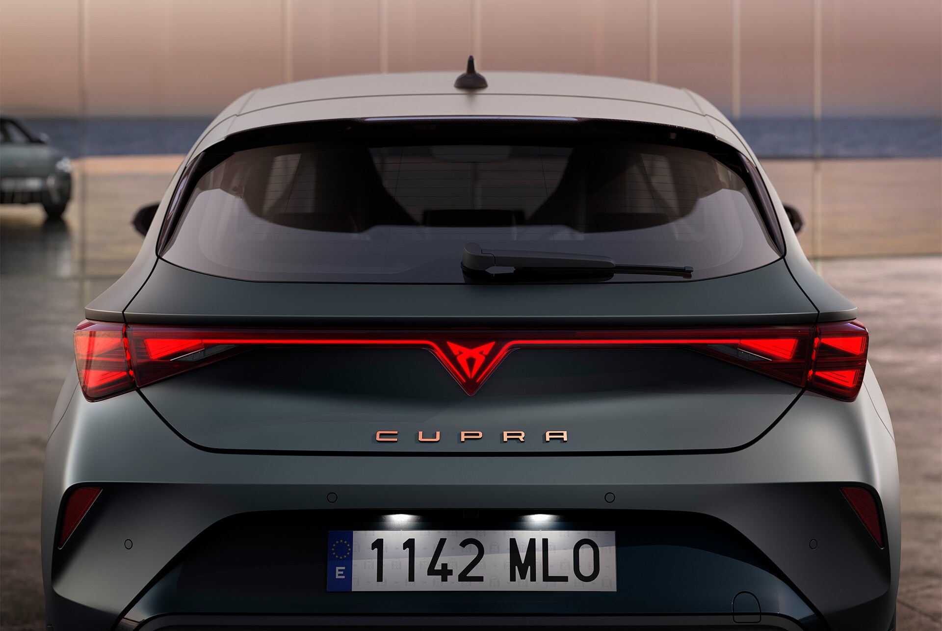 view of new cupra leon 2025 hybrid car's boot and rear lights, LED lighting, integrated led cupra logo