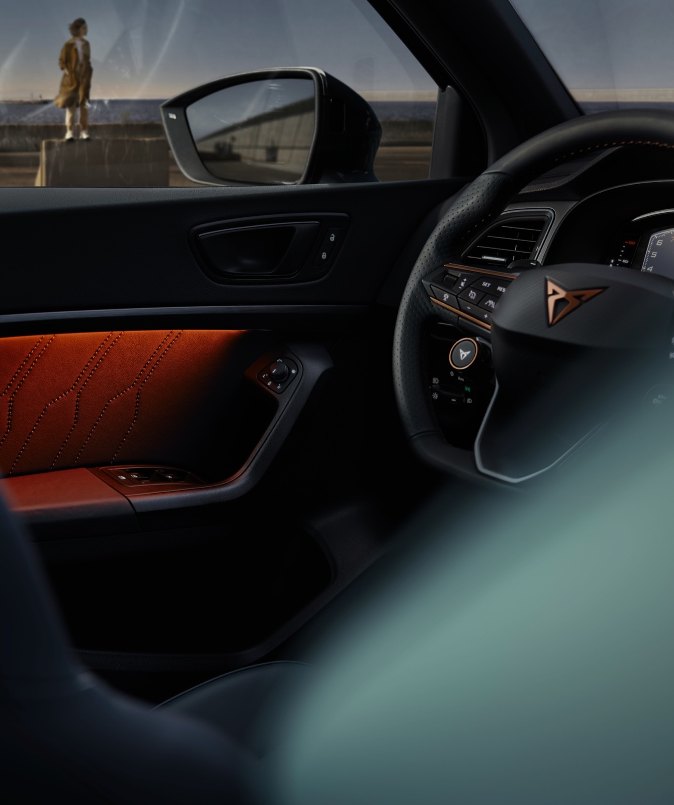 CUPRA interior car view of the steering wheel and rear mirror